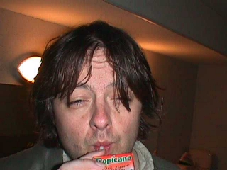 Troy sipping a strong beverage